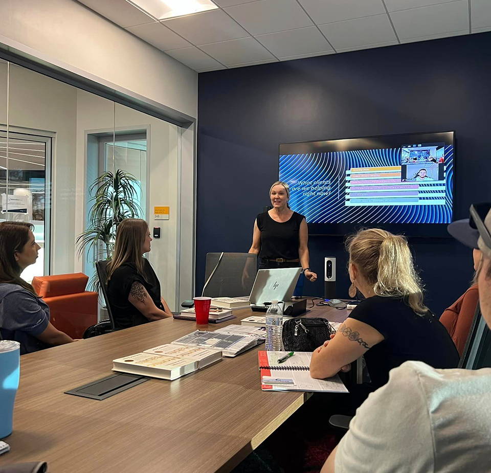 Jennifer Lampe presenting to the group at a networking roundtable